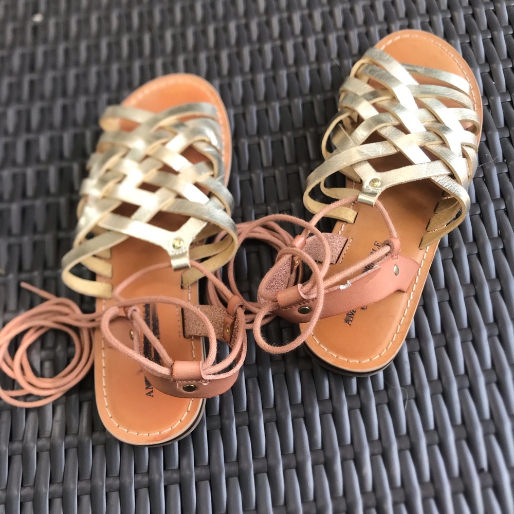 American Eagle gold gladiator shoes